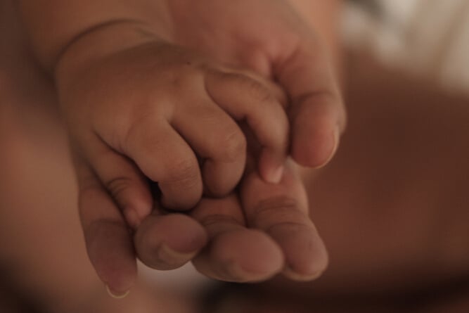 Closeup of Mother and Baby's Hands